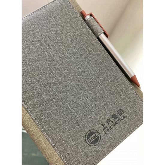 A5 Moleskine-like hard-cover business grid notebook with elastic band. A5 Moleskine-like hard-cover business grid notebook with elastic band.