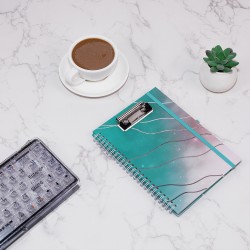 A5 spiral-bound notebook with gold double-ringed paper cover, printed envelope, and storage bag.