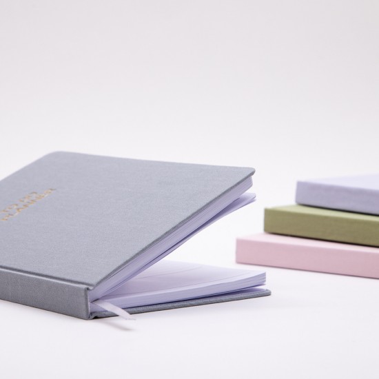 Business notebook with business card pocket on the cover, elastic pen holder, and acid-free paper with printed inner pages Business notebook with business card pocket on the cover, elastic pen holder, and acid-free paper with printed inner pages