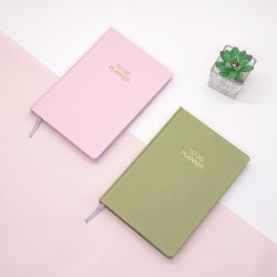 Business notebook with business card pocket on the cover, elastic pen holder, and acid-free paper with printed inner pages